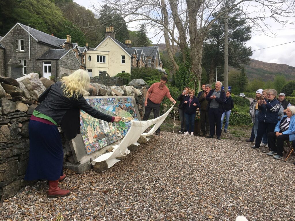 Former local councillor Andrew Baxter unveils the mosaic at the weekend. NO F19 Nether Lochaber mosaic 01