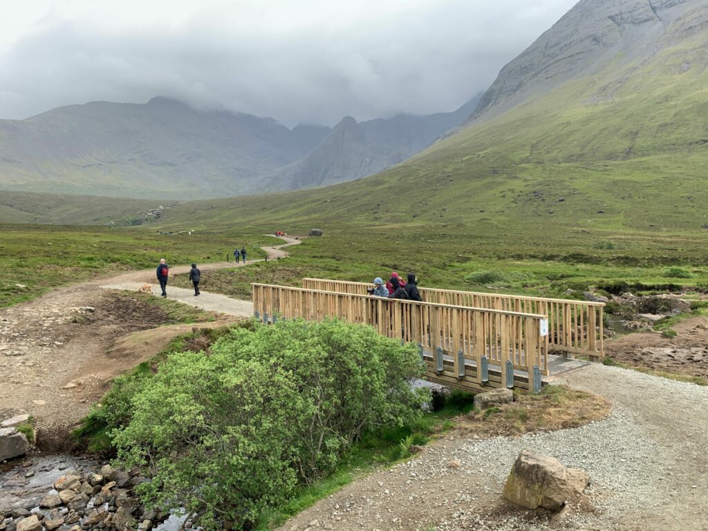 The completed bridges form part of the ongoing work carried out by the Outdoor Access Trust for Scotland on the Skye Iconic Sites Project (SISP). NO F27 OATS The Fairy Pools Bridge Installation 1