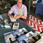 Moidart author Angus MacDonald signing copies of his books on his recent promotional tour to Canada. NO F29 Angus in Canada 01 extra