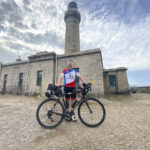Andrew Peterson finally reaches the most westerly point in the UK, at Ardnamurchan lighthouse. Photograph: Dominic Glasgow. NO F30 AndrewPeterson_1