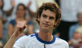 Andy Murray celebrates beating USA's Andy Roddick at the Wimbledon Tennis Championships in 2006. He is about 19 or 20 years old here and has his trademark curly hair at the time.