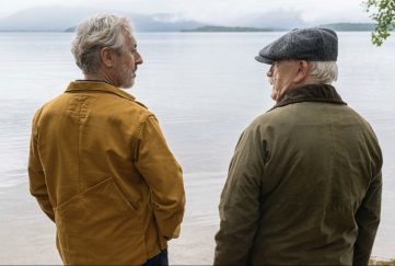 Alan Cummings and Brian Cox standing lochside in a still-frame from the film Glenrothan.