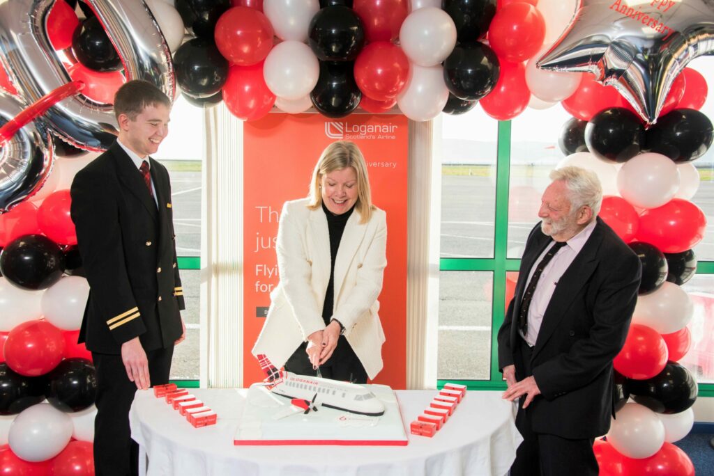 Celebrating Loganair's 60th anniversary are, from left: Pilot, Captain Aaron Dickson; chief commercial officer, Kay Ryan; Captain Geoff Rosenbloom, former Loganair pilot who flew with the airline in the 1970s.