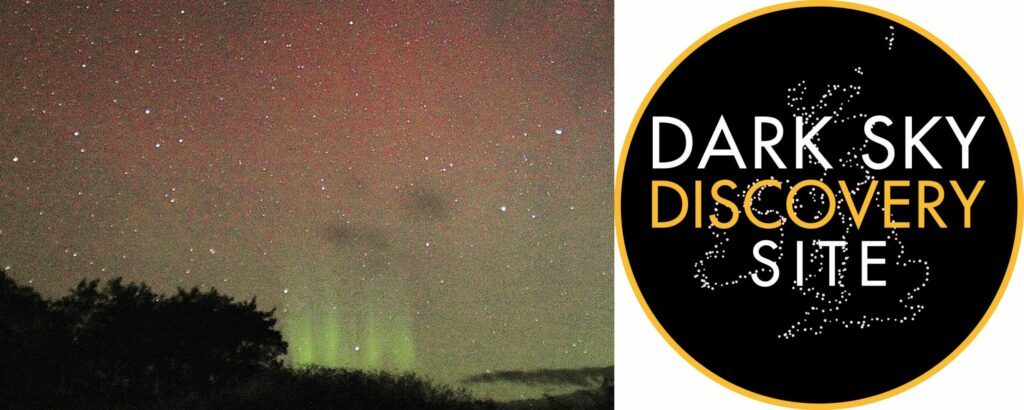 A stargazing spot on Gigha has been named a Dark Sky Discovery Site thanks to its views of the night sky. Photograph of stars and aurora as seen from Gigha in November 2021. Photograph: Keith Wilson. Logo: UK Dark Sky Discovery Partnership.