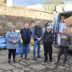 From left: coordinator Mandy Robertson; Kintyre Kollector's Arthur Murray and Ewan McHardy; and volunteers Joan Chestnut and Heather Mauchline, with the first load of donations and some of the remaining boxes.