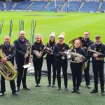 Willie Ralston, David Cosgrove, Cara McFadzean, Mae Barr, Katrina Barr, Emily Bennie, Scott MacAlister and Liam Bennie, pictured from left to right, performed with Whitburn Band, Murrayfield's resident brass band.