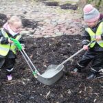 In the litter section of Dalintober's Eco Action Plan, the school prioritises beach cleans which children from the early learning centre to P7 participate in. The children also learn skills for learning, life and work through the eco programme, as this photograph of two early learning centre pupils shows.