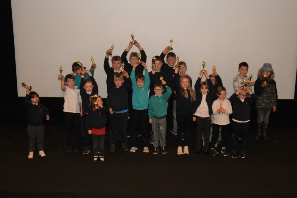 The children of Clachan, Rhunahaorine and Glenbarr primary schools with their awards after their animation showcase.