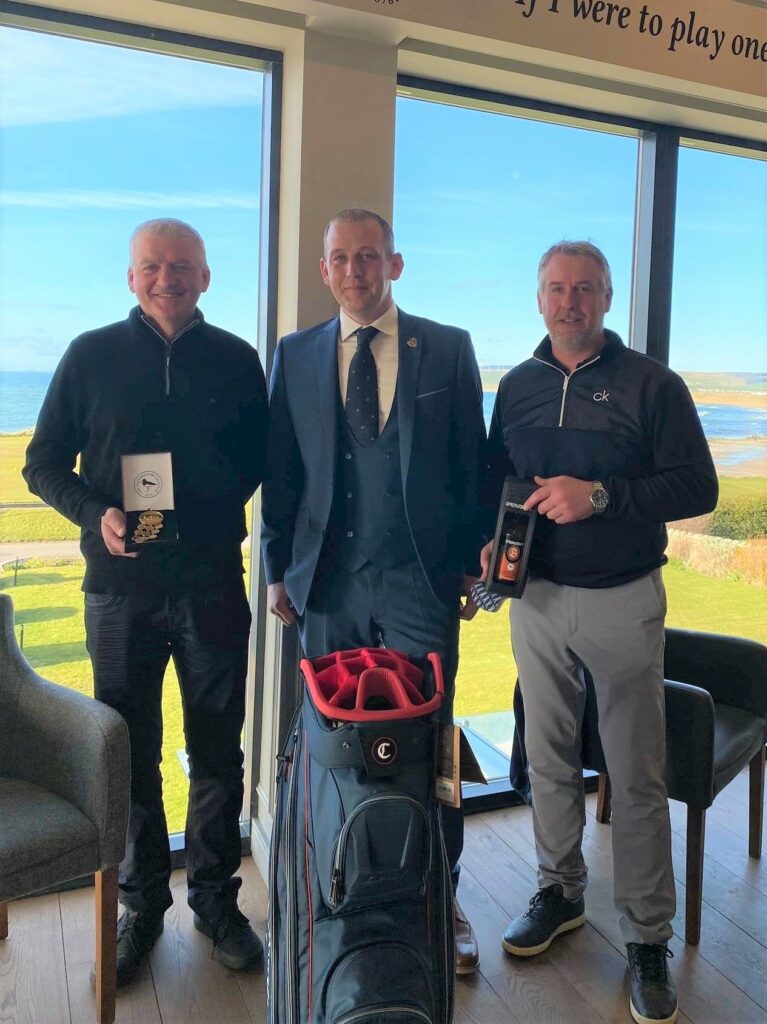 Machrihanish Golf Club captain Darren Kelly, centre, presents the Spring Meeting and Captain's Prize awards to Barry Colville, right, and George MacMillan. 