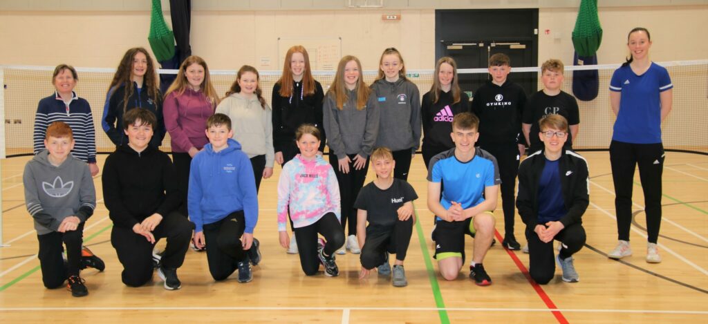 Anne Littleson, organiser of the coaching session, back left, and Scotland international badminton player and coach Sarah Sidebottom, back right, with the secondary school players.