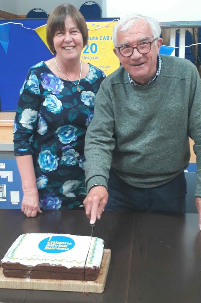 Iain Ritchie, chairman of Argyll and Bute Citizens Advice Bureau, and board member Elly Bittleston cut the celebration cake.