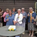 Campbeltown Flower Club members raise a glass in celebration of the group's golden anniversary. They are, from left: Judy Orr, Alyson Grant, Liz Kennedy, Pauline Simson, Isabel Cook, Morag Johnston, Moira Menzies, Margaret McKendrick and Jane Miller.