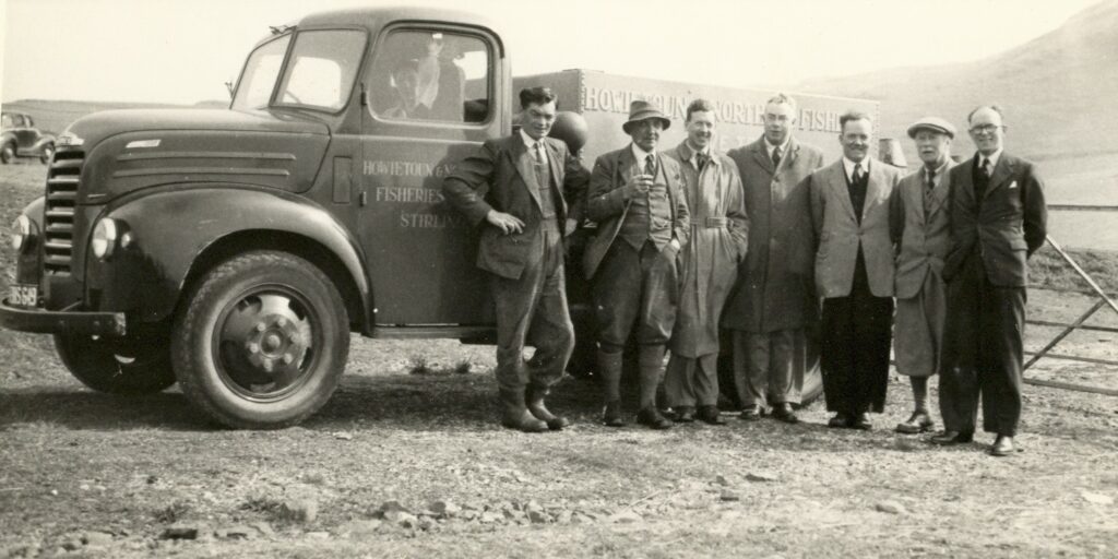 The 1952 photograph Ronald J Roberts shared of Howietoun and Northern Fisheries delivering fish to Auchalochy shows, from left: Alexander Shorthouse, the driver; Donald Fraser, gamekeeper; Hugh Thomson, club president; Councillor A P McGrory; Ronald Roberts, club secretary; Duncan Colville and Councillor Archibald Keith.