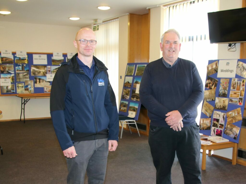 Malcolm McMillan, MACC Developments Ltd development manager, shows Councillor John Armour the open day information boards.