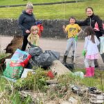 Some of the adults and children who got involved with the 'Big White Shore Beach Clean'.
