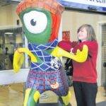 In 2012: Campbeltown Grammar School pupil Amy Shaw welcomed the official London 2012 Paralympic Games mascot to Glasgow after winning the Scottish leg of a competition to design her own Scottish version of the mascot. She is photographed with her winning Mandeville design.