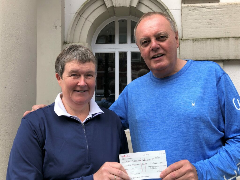 Ann Gallacher, treasurer of CCWF, handing over a cheque for £3,000 to James McCorkindale, principal teacher at the McCorkindale School of Dancing. The money will be used towards the purchase of a new outdoor dancing platform, which will be built locally to meet the requirements of the Royal Scottish Official Board of Highland Dancing.