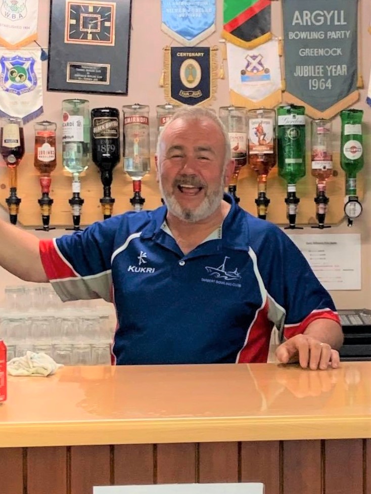John 'Yo-Yo' McAlpine behind the bar at Tarbert Bowling Club.