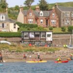 The existing sailing club, centre, was described by planners as functional but 'untidy' in appearance.
