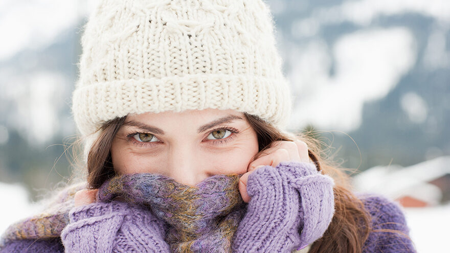 Woman in cap, scarf and gloves