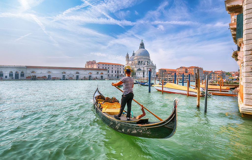 Breathtaking morning cityscape of Venice with famous Canal Grande and Basilica di Santa Maria della Salute church. Top romantic destinations in Europe