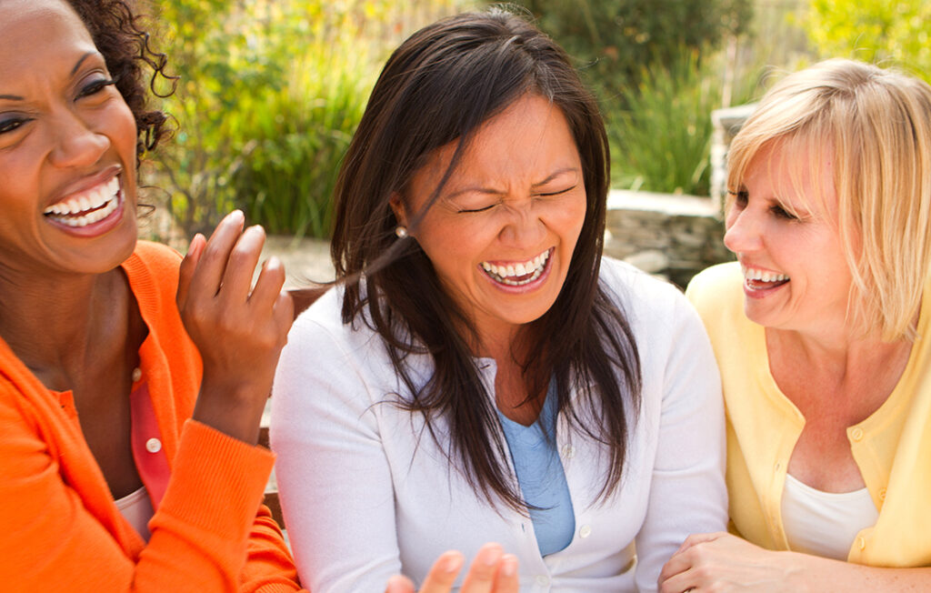Three women laughing and having fun Pic: Shutterstock