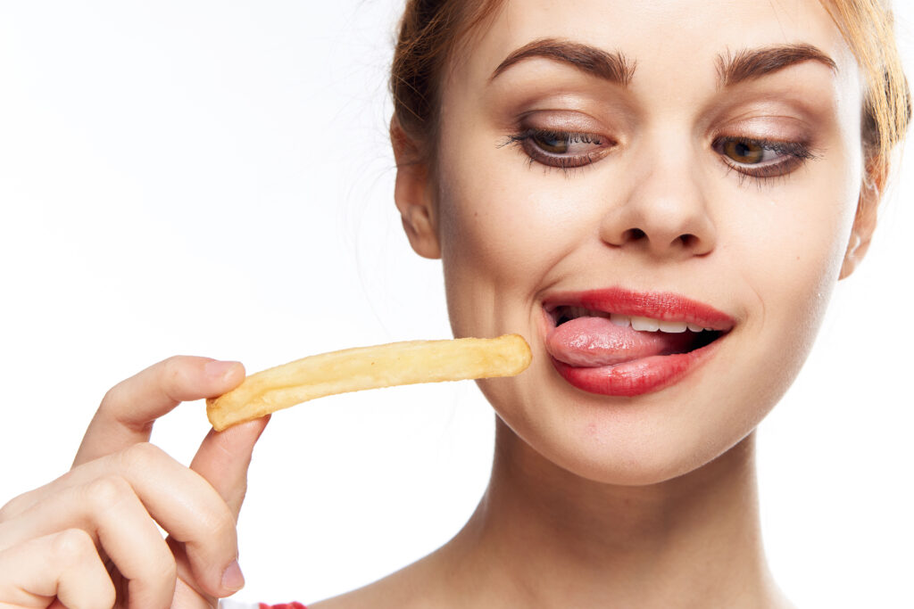 Woman eating huge chip