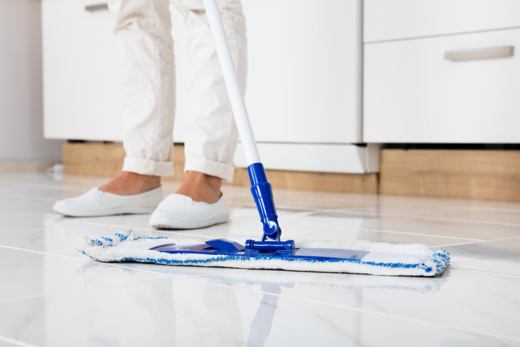 Cleaning Service Woman Mopping The Floor In Kitchen At Home; 