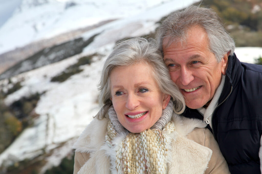 Portrait of happy senior couple at the mountain; 