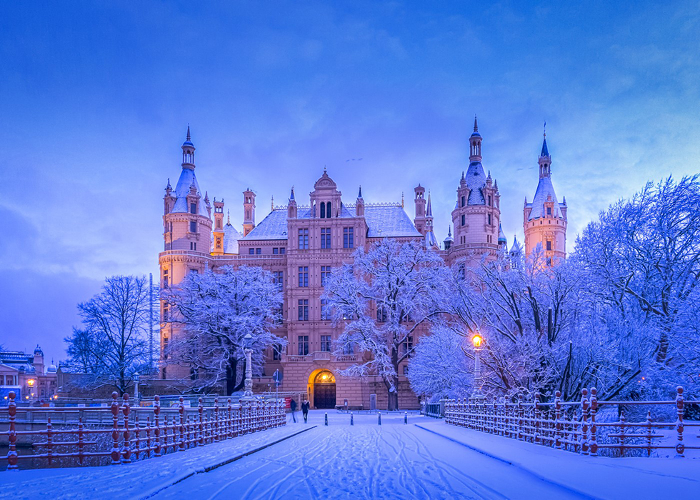 A picturesque snowy scene captured on a frosty morning in Schwerin, Germany, by Ralph Poschmann.