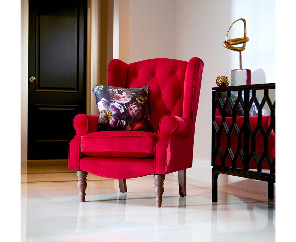 Red armchair with blue floral cushion