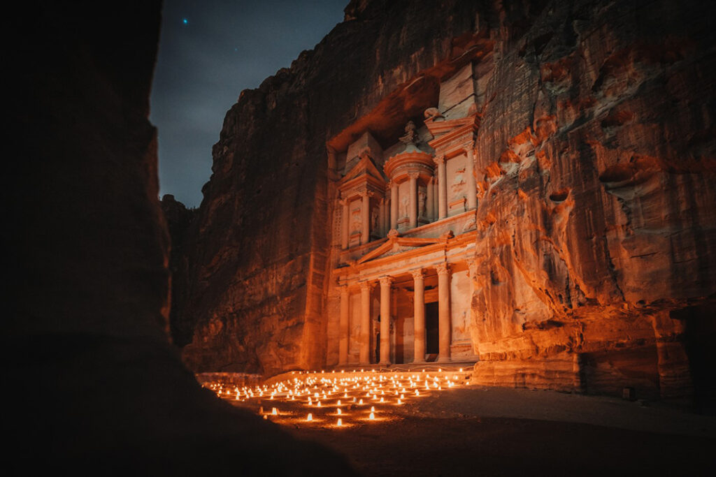 Petra is surrounded by candles making it glow in the night captured by Vincenzo Avallone.