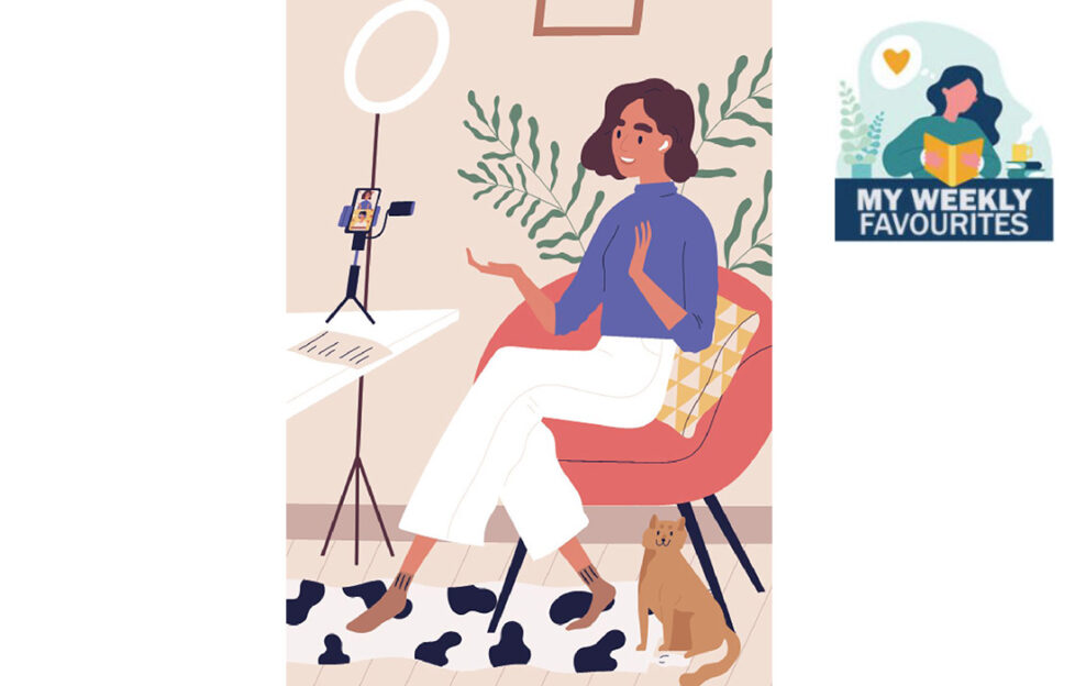 Woman doing a piece to video camera with cat by her side Illustration: Shutterstock