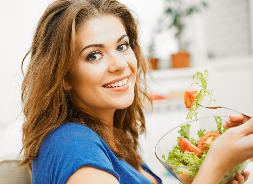 Healthy lady eating salad Pic: Shutterstock