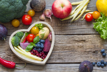 Healthy food in heart diet cooking concept with fresh fruits and vegetables;