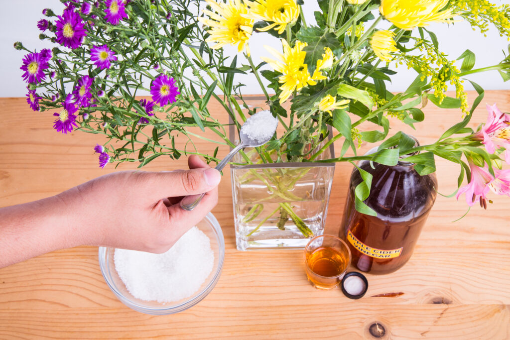 Add baking soda to vase of cut flowers