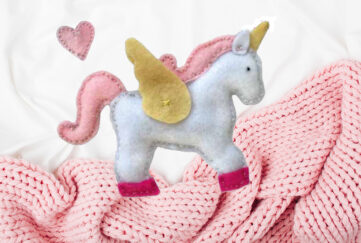 Unicorn from baby's mobile. Background pic: Shutterstock