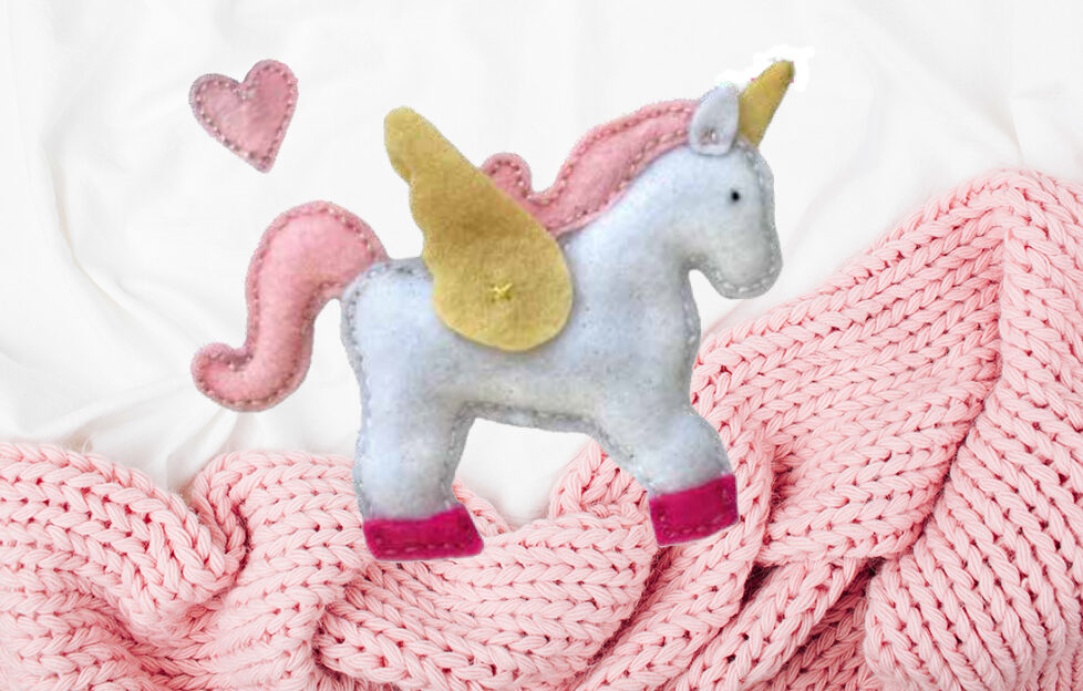 Unicorn from baby's mobile. Background pic: Shutterstock