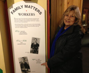 Mum Audrey nee Revell next to The Revells placard in Sunderland Museum
