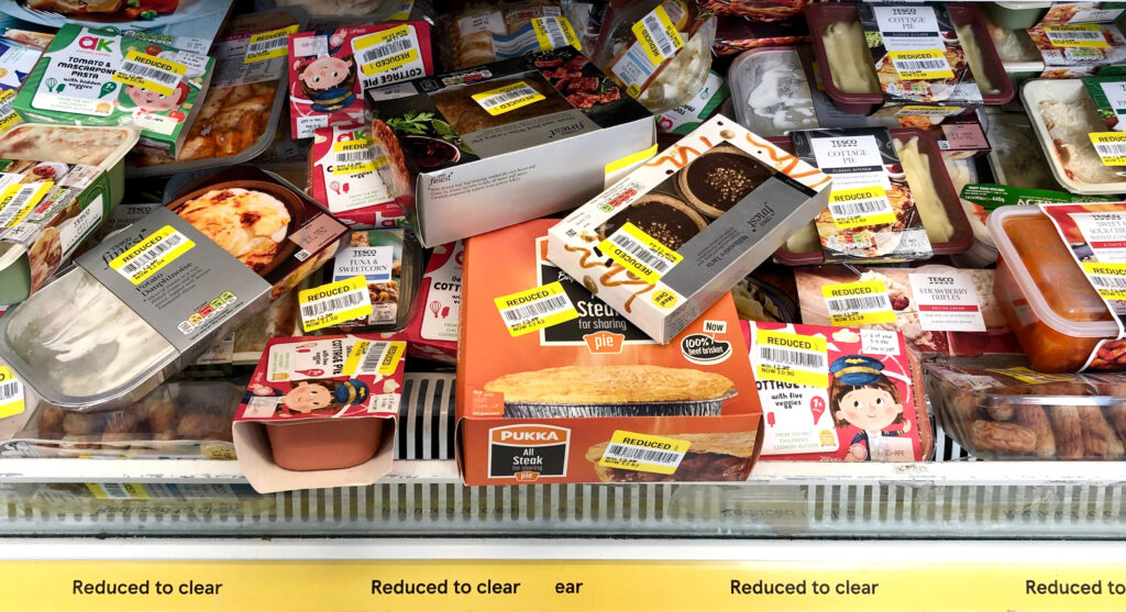 Yellow stickers on marked down food in supermarket