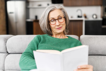 Lady reading book indoors Pic: Shutterstock