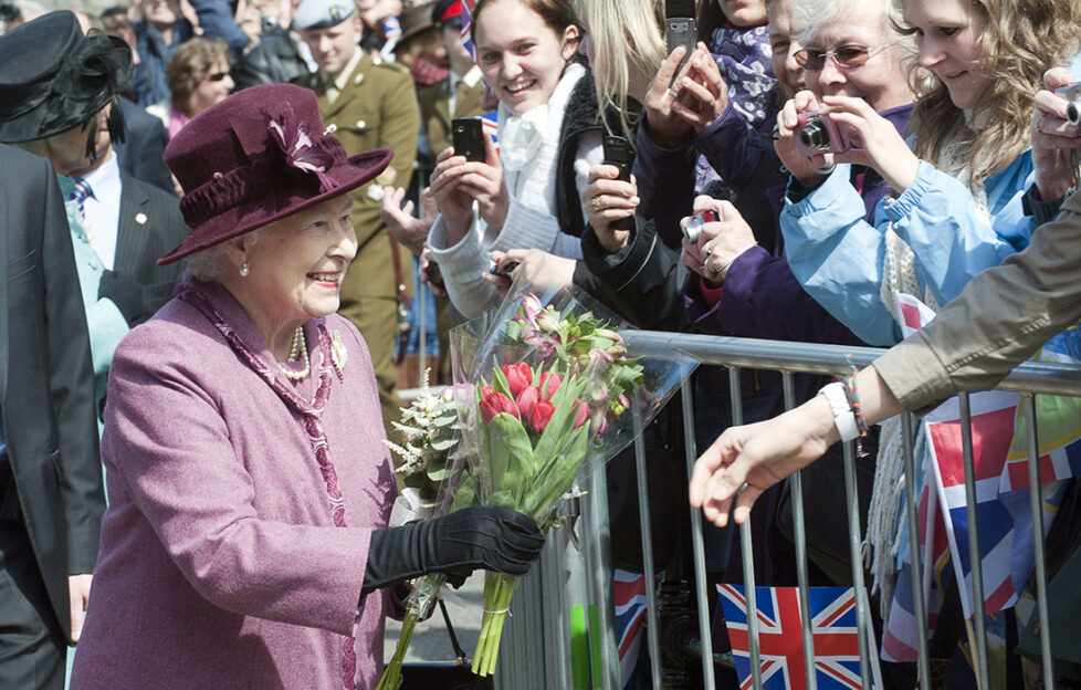 The Queen meeting members of the public Photo by David Parker/Afp/Getty Images/Shutterstock (2321875a) Britain's Queen Elizabeth Ii (l) Receives Flowers From Members Of The Public On A Walk Through Windsor West Of London On April 30 2012 To Visit Guildhall On Her Diamond Jubilee Tour. Afp Photo / David Parkerdavid Parker/afp/gettyimages