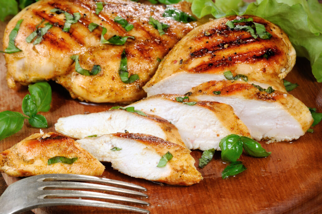 Sliced juicy, tender chicken breast grill close-up.; 
