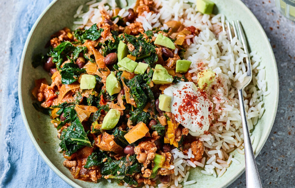 Plate of chicken and vegetable chilli and rice