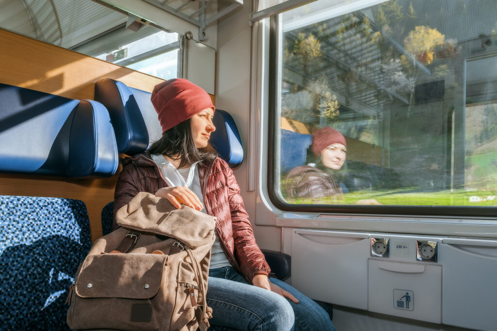 Female backpacker on European train
