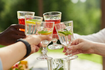 Hands holding cocktails Pic: Shutterstock