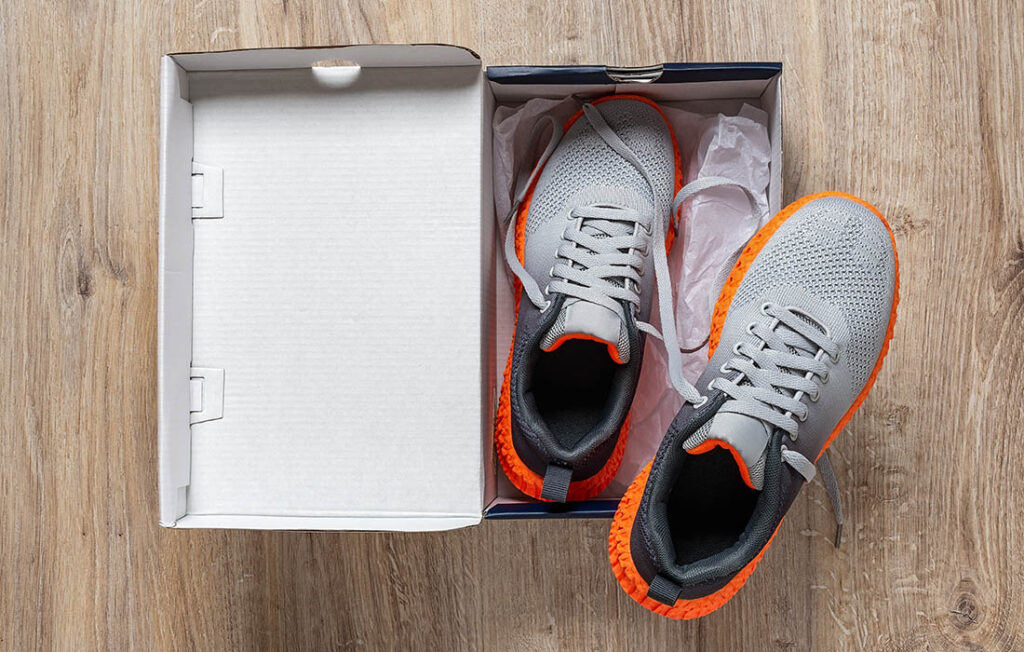 Pair of trainers in opened box