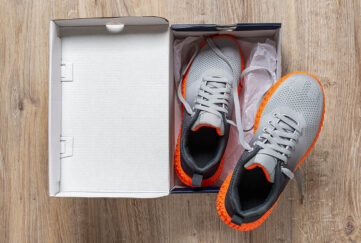 Pair of trainers in opened box