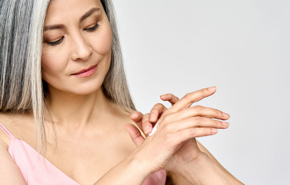 Lady applying skin cream Pic: Shutterstock