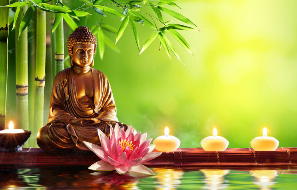 Buddha statue and candles Pic: Shutterstock